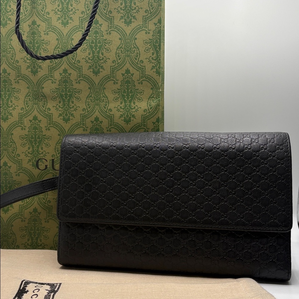 Gucci Black Embossed Leather clutch